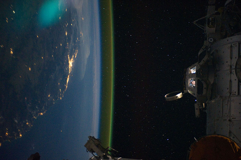 Illustration for article titled Holy crap! Why is the Earth glowing green?